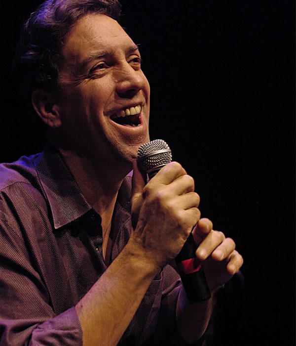 David Gonzalez holding a mic